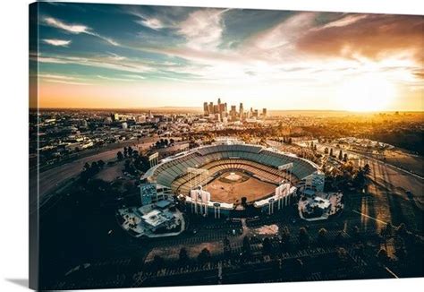 Aerial View Of The Dodgers Stadium With The Los Angeles Skyline In The