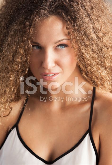 Portrait Of A Beautiful Woman With Curly Hair Stock Photo Royalty
