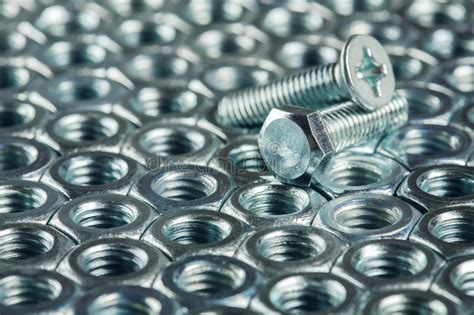 Nuts Bolts Screws On A Dark Concrete Background Stock Photo Image