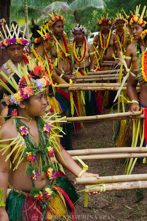 Yapese Girls In Traditional Clothing Dancing With Bamboo Pole At Yap
