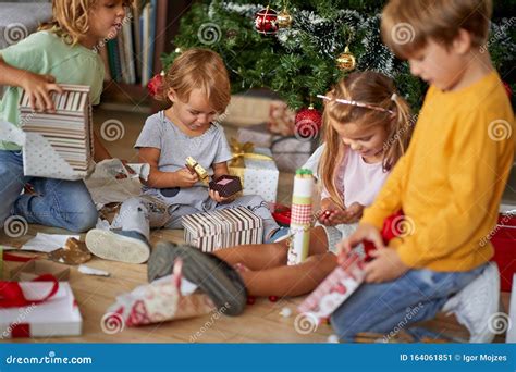 Children Opening Xmas Presents Kids Under Christmas Tree With T