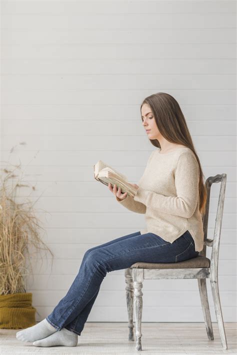 Garden is such a place that you can hang around with your family, friends, and relatives and when there is the best of the garden chair available with a desk sort of thing to store. An attractive young woman sitting on wooden chair reading ...