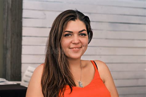 Portrait Side View Of A Young Beautiful Smiling Tanned Brunette Happy