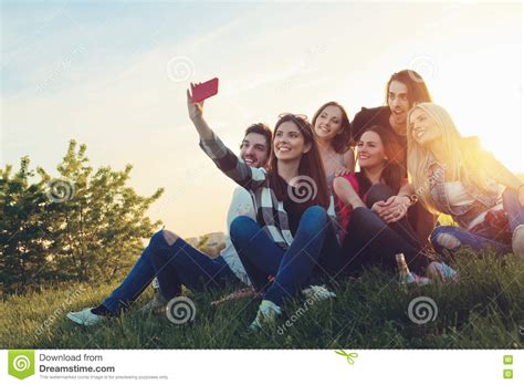 Group Of Young People Taking A Selfie Outdoors Stock Image Image Of