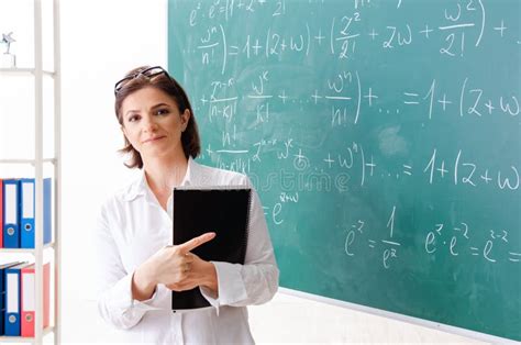 The Female Math Teacher In Front Of The Chalkboard Stock Image Image
