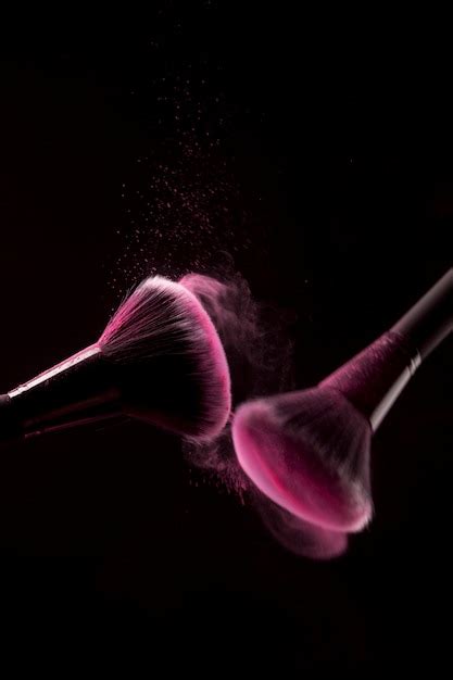 Free Photo Makeup Brushes With Pink Powder Splash