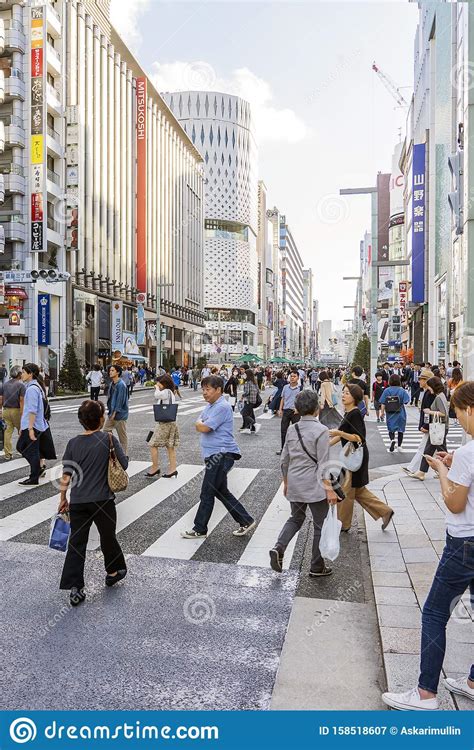 People Are Crossing Ginza Street In Tokyo Editorial Photography Image