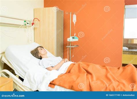 Thoughtful Senior Patient During Treatment At Hospital Stock Image
