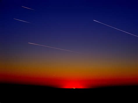 Shooting Stars Passing During Sunset Hd Wallpaper Wallpaper Flare