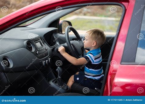 Cute Little Boy Driving Fathers Car Child In The Car Stock Image