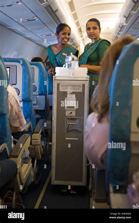 Cabin Crew With A Food And Drinks Trolley On A Srilankan Flight Stock