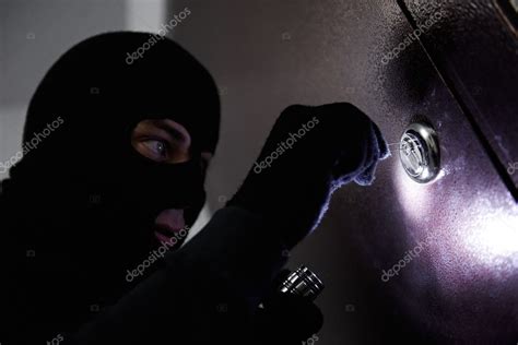 Thief Burglar At House Breaking — Stock Photo © Kalinovsky 18572665
