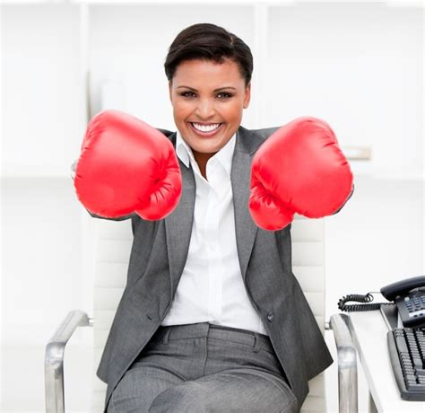 Premium Photo Attractive Businesswoman Wearing Boxing Gloves Sitting