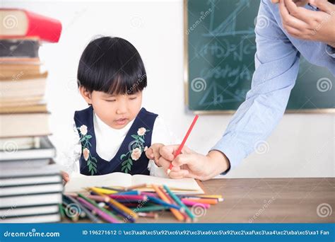 The Teacher Gives Student Homework Stock Photo Image Of Counseling