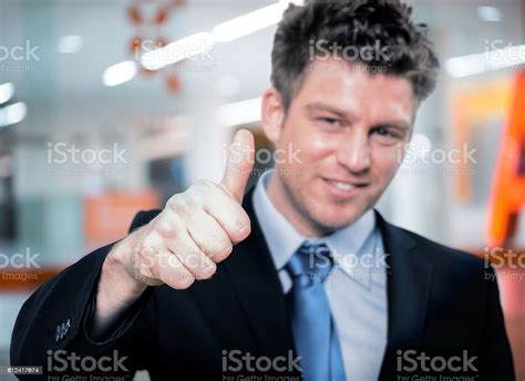 Happy Handsome Business Man Holding Thumbs Up Stock Photo Download