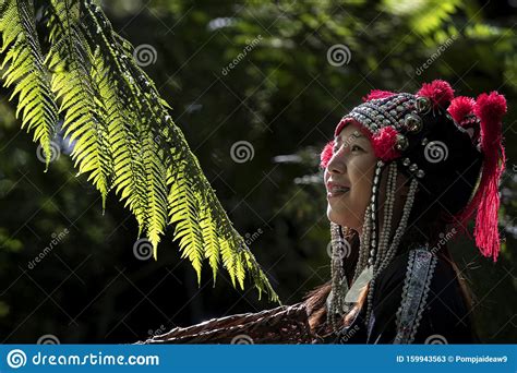 hmong-girl-her-have-tooth-braces-and-standing-in-the-forest-with-a