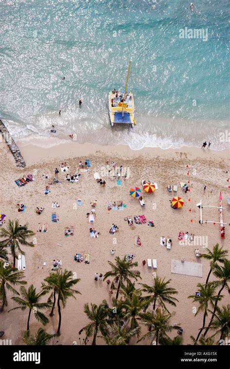Holiday Crowds Sunbathing Relaxing And Enjoying Waikiki Beach Honolulu