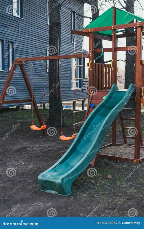Blue Plastic Children`s Slide On A Wooden Game Complex Children`s