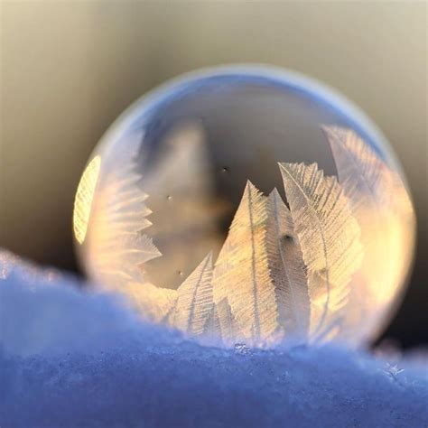 A Crystal Ball Sitting On Top Of Snow Covered Ground