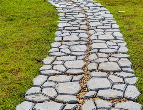 Garden Stone Path With Grass Growing Up Between The Stones Stock Image