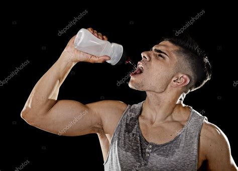 Young Athletic Sport Man Thirsty Drinking Water Holding Bottle Pouring