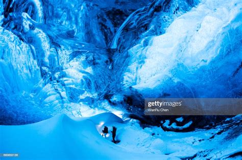 Traveler Enjoying Exotic Landmark Sitting In The Crystal Ice Cave High