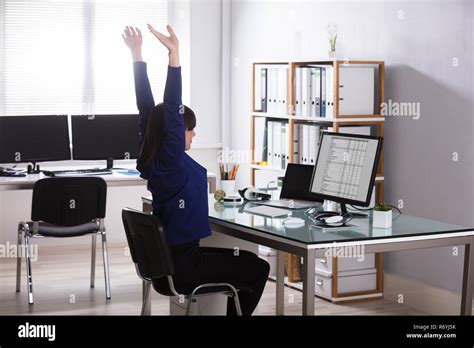 Businesswoman Raising Her Arms Stock Photo Alamy