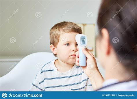 Pediatrician Measuring A Fever In A Child Stock Photo Image Of Child