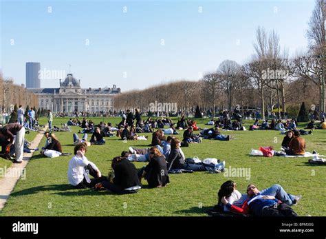 Paris France People Enjoying The Sunshine Of A Spring Morning In