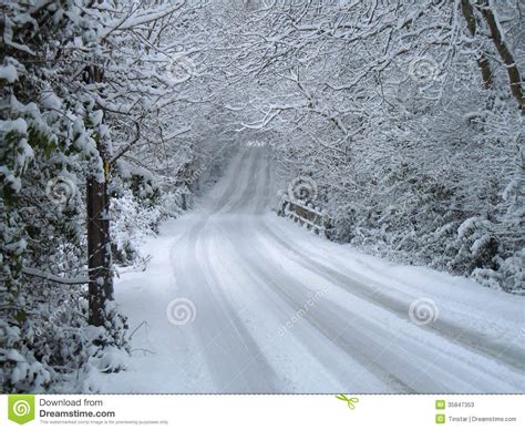 Winter Scene Of Snow Covered Road And Trees Stock Photos