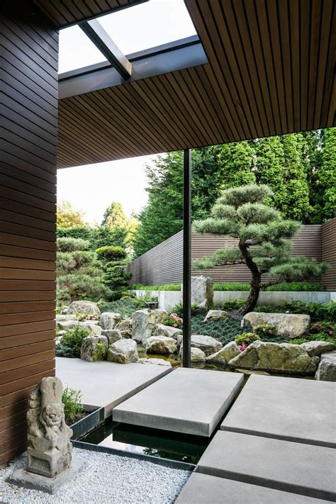 A Japanese Garden With Rocks And Trees