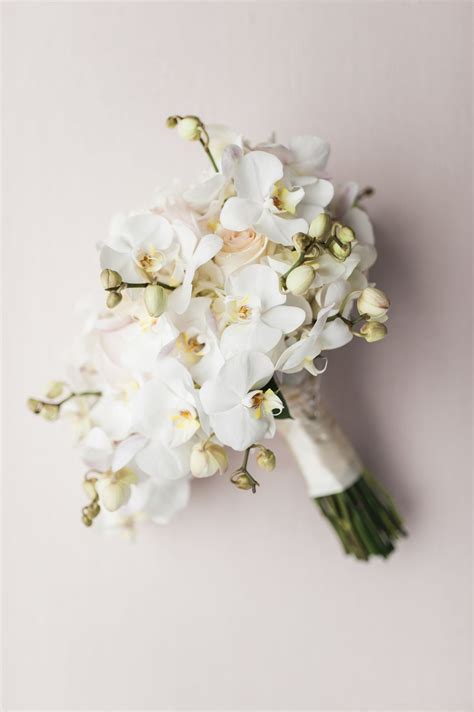 Modern All-White Orchid Bouquet | Orchid bouquet, Orchid bouquet wedding, Orchid bridal bouquets