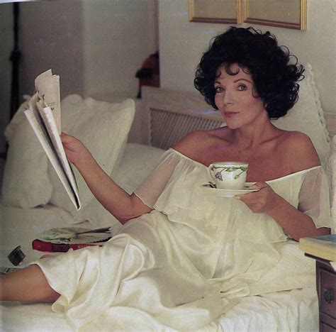 Joan Collins On The Bed During The Making Of Her Workout Tape In