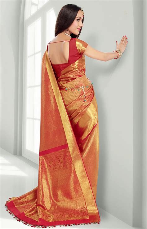 Red Pure Silk Saree With Gold Motifs Throughout The Saree And A Wide