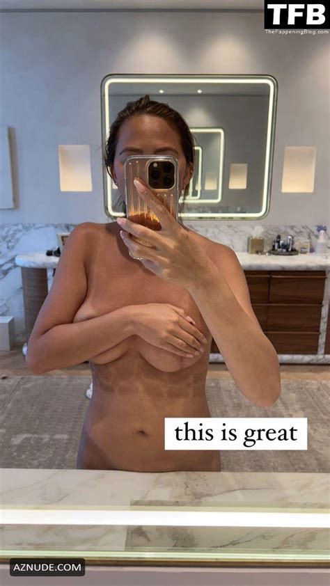 chrissy teigen sexy poses topless showing off her nude tits in a mirror selfie on social media