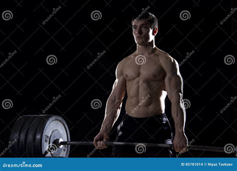 Young Shirtless Man Doing Deadlift Exercise At The Gym Stock Photo