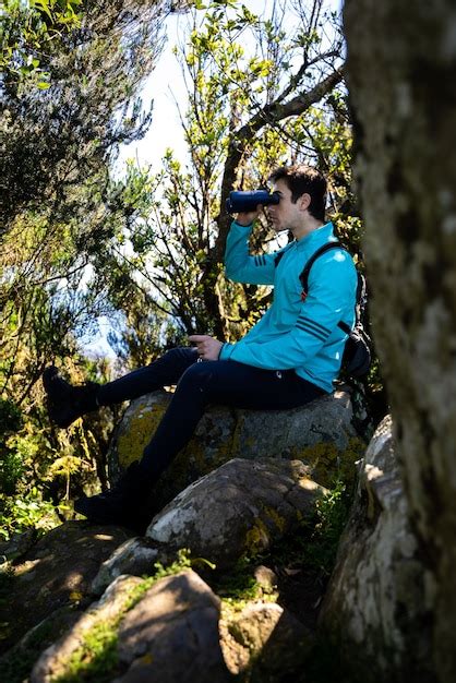 Premium Photo Hiker Boy Observing The Landscape With His Binoculars