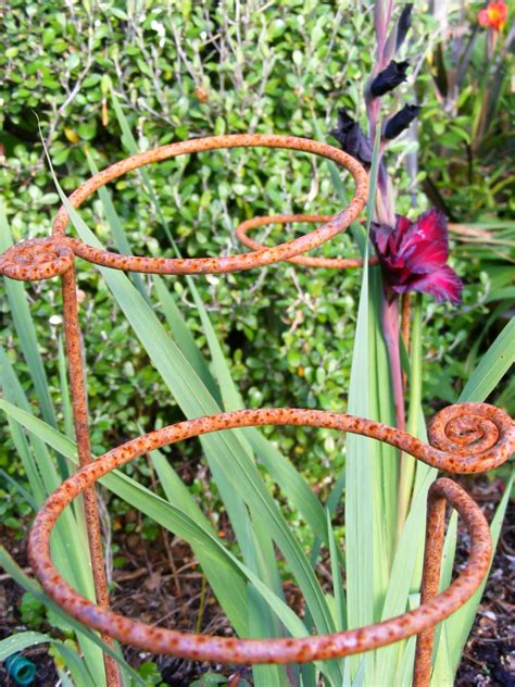 Choose from wooden, glass or recycled metal garden ornaments, tealight holders, decorative plant stakes and outdoor mirrors to smarten up any. Rachel Callaghan Landscape Architect, NZ: Metal Plant Supports