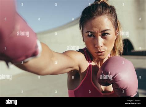 Fit Young Woman Wearing Boxing Gloves Doing Punching Workout Female