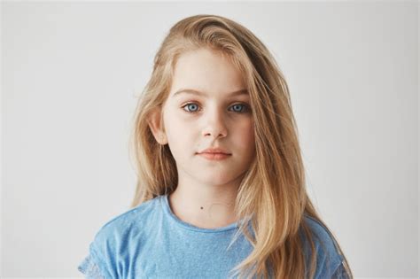 Close Up Portrait Of Beautiful Little Girl With Light Long Hair And Big
