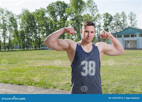 Young Athlete Shows Biceps Stock Image Image Of Motion 147079915