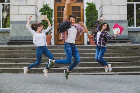 Free Photo Cheerful Students Jumping In Excitement