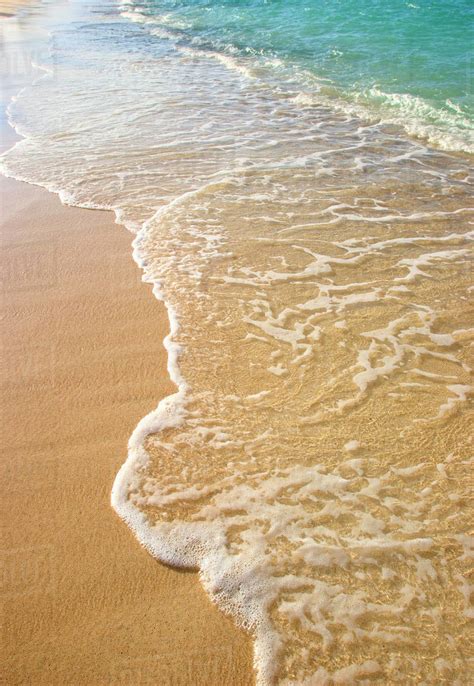 Gentle Waves Washing Onto Sandy Tropical Beach Stock Photo Dissolve