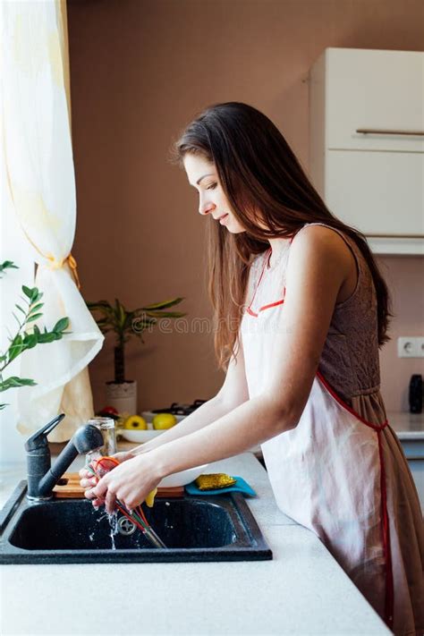 Girl Housewife Washes Dirty Dishes In The Kitchen Stock Photo Image Of Home Female