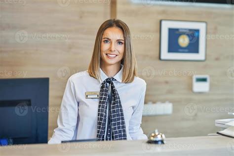 Receptionist At Hotel Front Desk 15856715 Stock Photo At Vecteezy