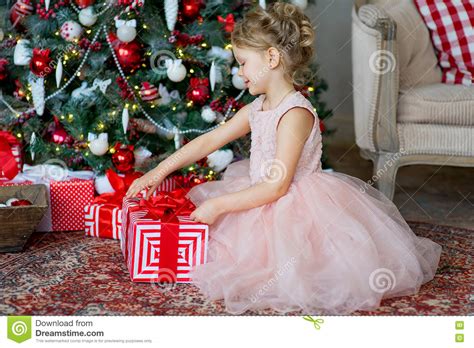 Little Girl With Christmas T Sitting Near Tree Stock Photo Image