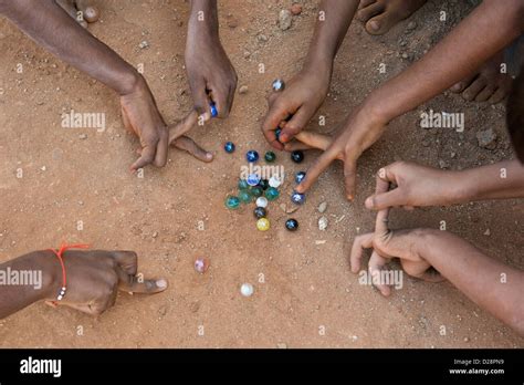 Indian Boys Playing Marbles In A Rural Indian Village Andhra Pradesh