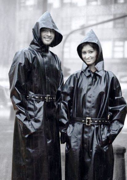 love is being a happy couple enjoying the rain in matching rubber mackintoshes rubber