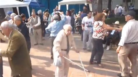 An Elderly Man Throws Crutches Away To Dance
