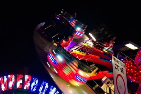 colourful spinning fun fair ride at night with motion blur stock image image of lights ride